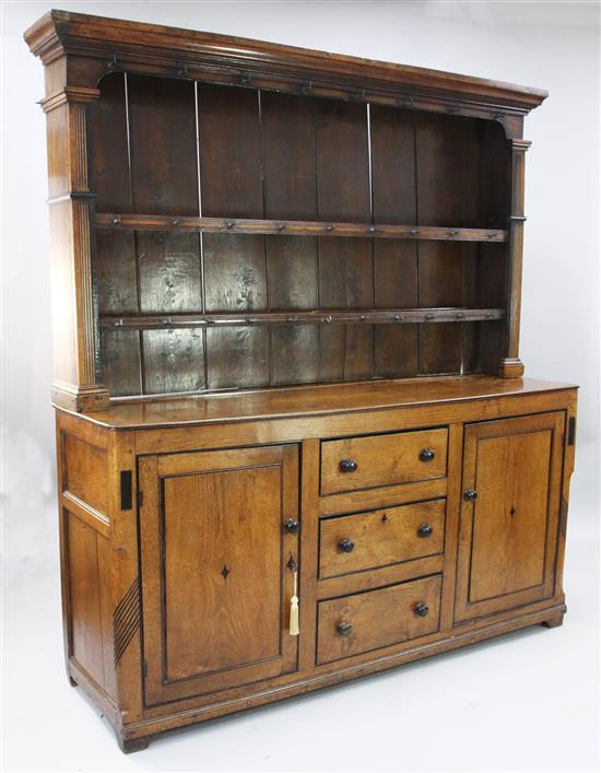 A George III Anglesey region golden oak and ebonised dresser, W.5ft 10in. D.1ft 8in. H.6ft 5in.